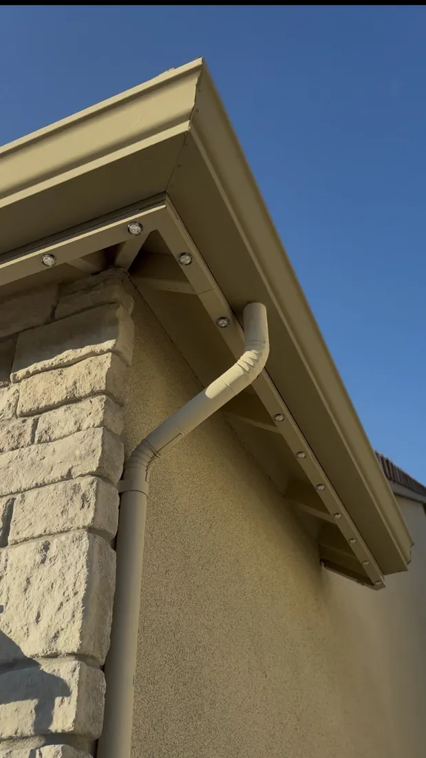 Color-matched track integrated into the roofline corner, nearly invisible by day