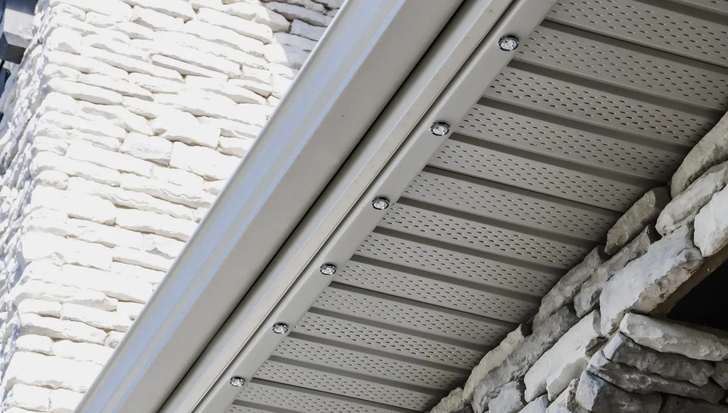 Close-up of recessed LED fixtures mounted in the soffit track